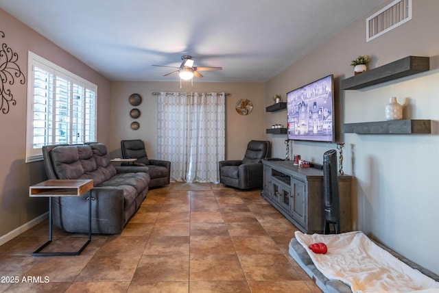 tiled living room with ceiling fan