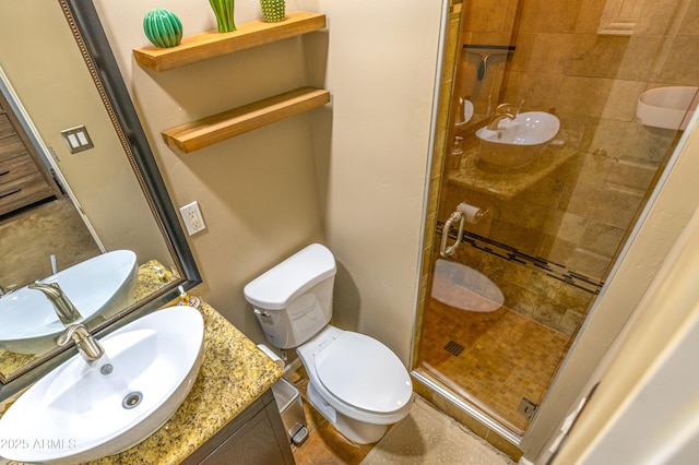 bathroom with vanity, toilet, and an enclosed shower