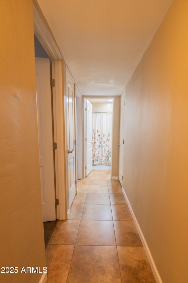 hallway with light tile patterned flooring