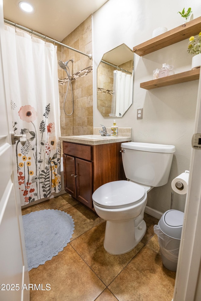 bathroom with vanity, a shower with shower curtain, tile patterned floors, and toilet