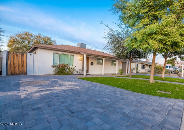 ranch-style house with a front yard