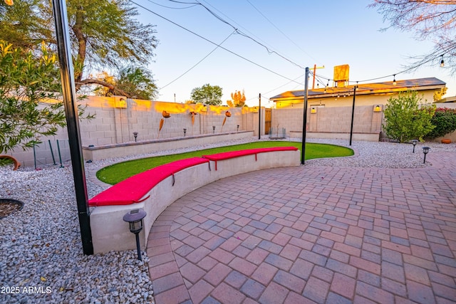 view of property's community with a patio area