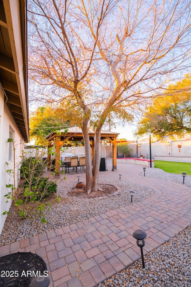 exterior space featuring a gazebo and a patio area