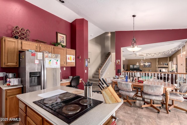 1802 W Encinas St, Gilbert, AZ 85233 - kitchen featuring stainless steel refrigerator with ice dispenser, vaulted ceiling, black electric stovetop, light countertops, and decorative light fixtures