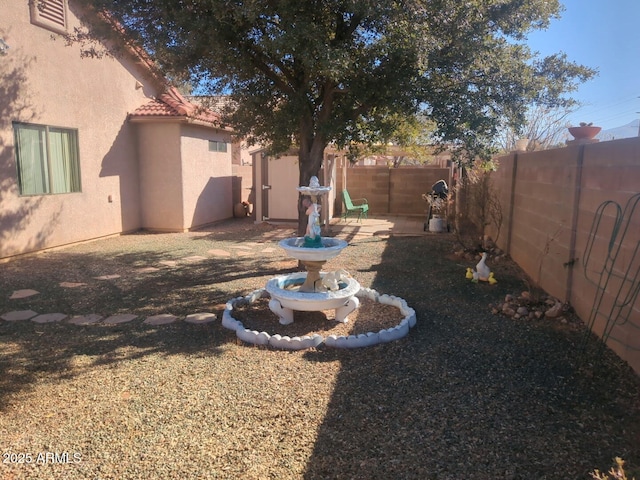 view of yard featuring a fenced backyard