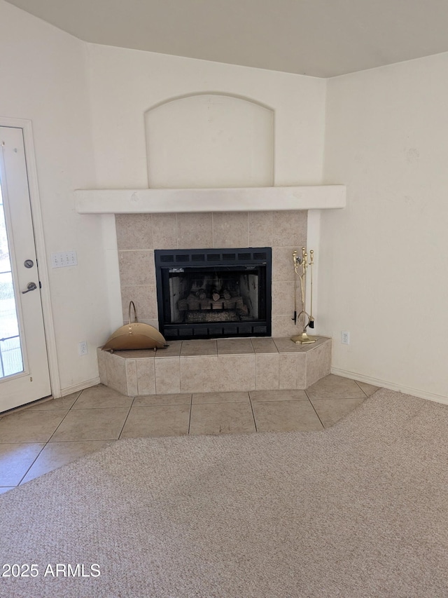 room details featuring a fireplace and baseboards