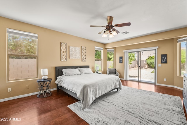 14430 W Windsor Ave, Goodyear, AZ 85395 - bedroom featuring access to exterior, multiple windows, wood finished floors, and baseboards
