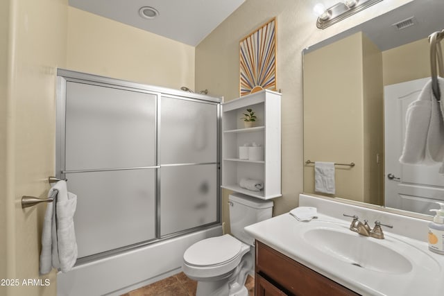 14430 W Windsor Ave, Goodyear, AZ 85395 - bathroom with toilet, vanity, and shower / bath combination with glass door