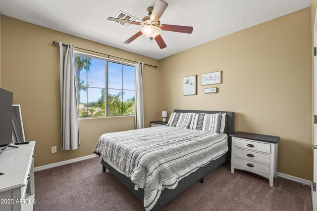14430 W Windsor Ave, Goodyear, AZ 85395 - bedroom with dark colored carpet, baseboards, and ceiling fan