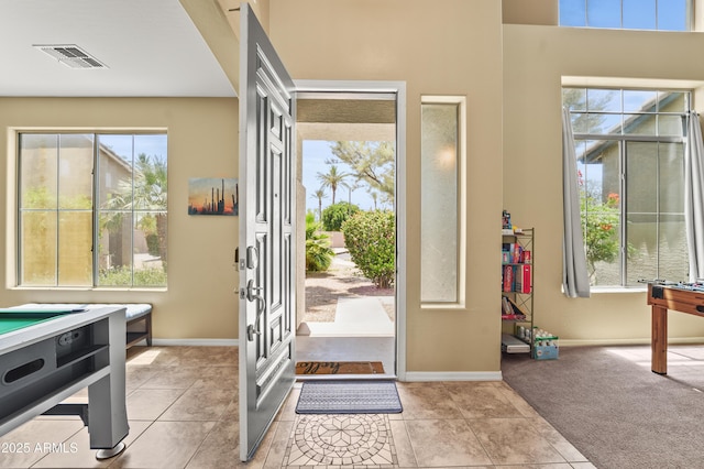 14430 W Windsor Ave, Goodyear, AZ 85395 - foyer entrance featuring healthy amount of natural light, baseboards, and light tile patterned floors