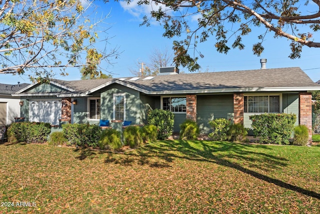 single story home with a front yard