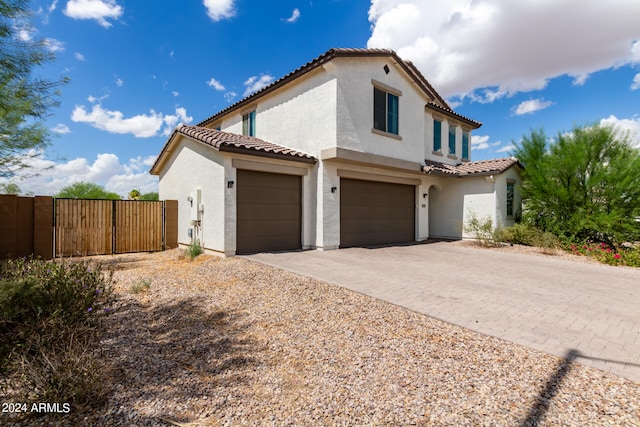 view of side of property with a garage