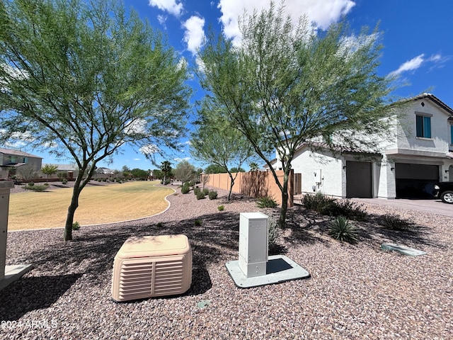 view of yard featuring a garage