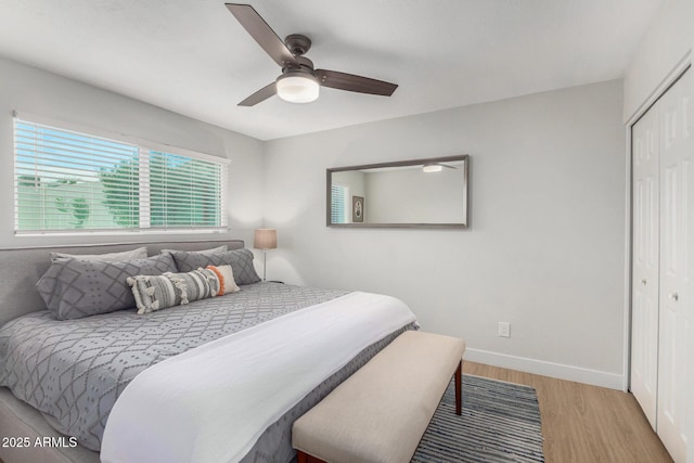 bedroom with ceiling fan, a closet, and light wood-type flooring