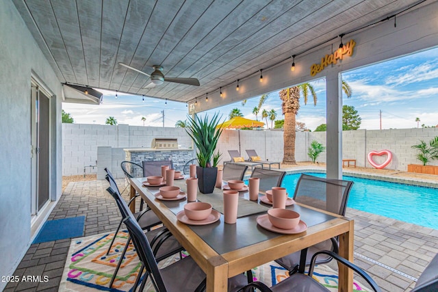 view of patio with ceiling fan and a fenced in pool