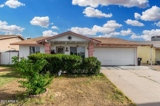 ranch-style home featuring driveway and a garage
