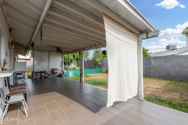 view of patio / terrace with a fenced backyard, central air condition unit, and ceiling fan