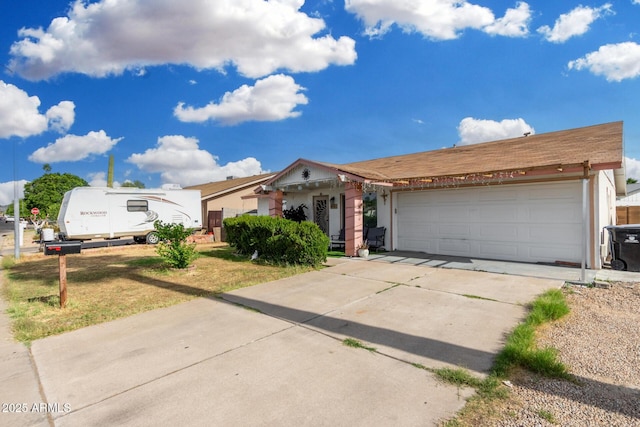 ranch-style home with an attached garage and driveway