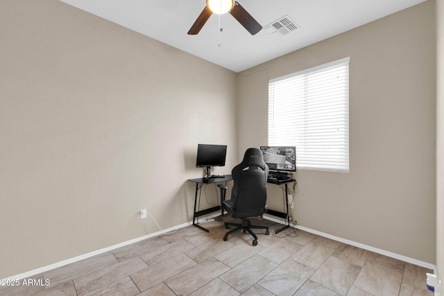 office with visible vents, baseboards, and a ceiling fan