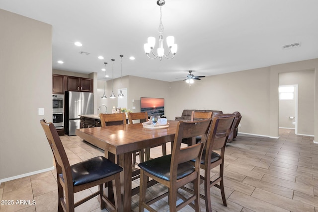 dining area with recessed lighting, visible vents, baseboards, and ceiling fan with notable chandelier