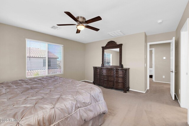 bedroom with visible vents, carpet floors, baseboards, and a ceiling fan