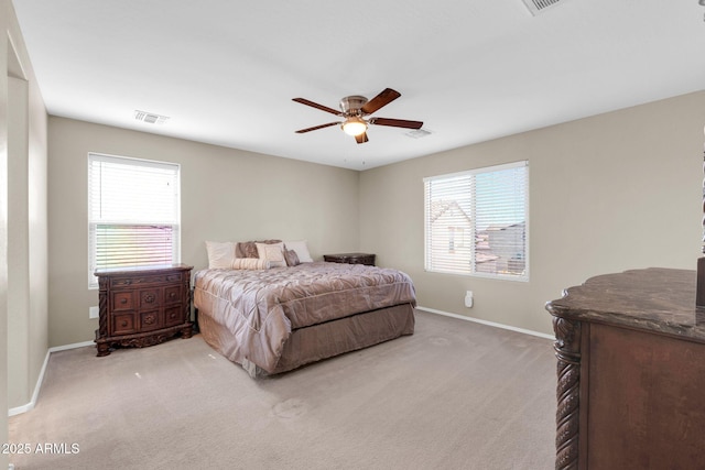 bedroom with visible vents, a ceiling fan, baseboards, and carpet floors