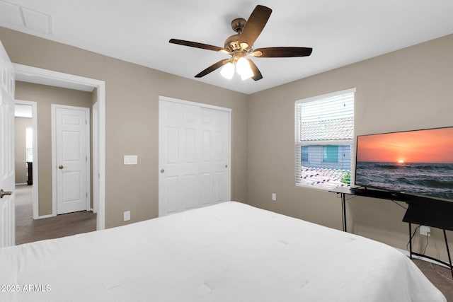 bedroom featuring visible vents, a closet, and ceiling fan