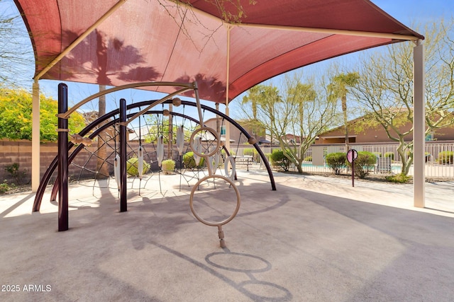 exterior space featuring playground community and fence