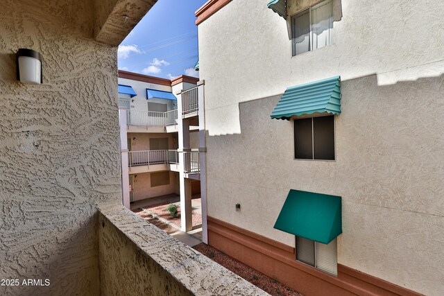 12123 W Bell Rd Unit 218, Surprise, AZ 85378 - exterior space featuring stucco siding and a balcony