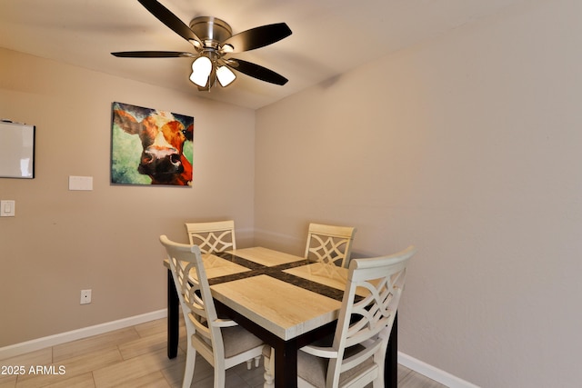 12123 W Bell Rd Unit 218, Surprise, AZ 85378 - dining room featuring baseboards and ceiling fan