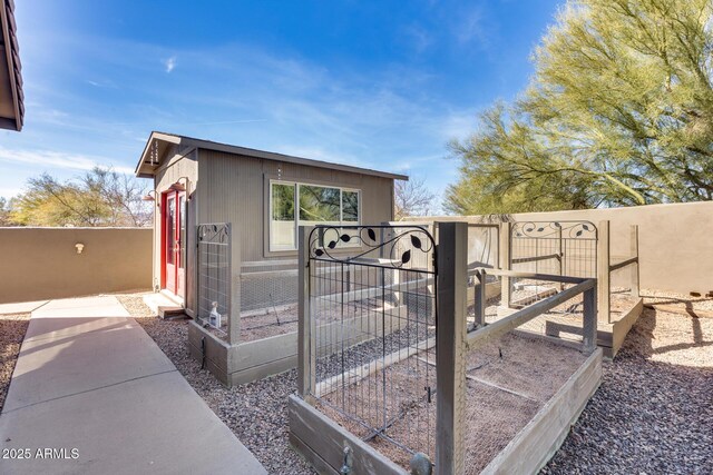 view of gate with fence