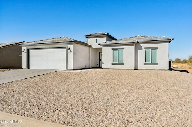 prairie-style home featuring a garage