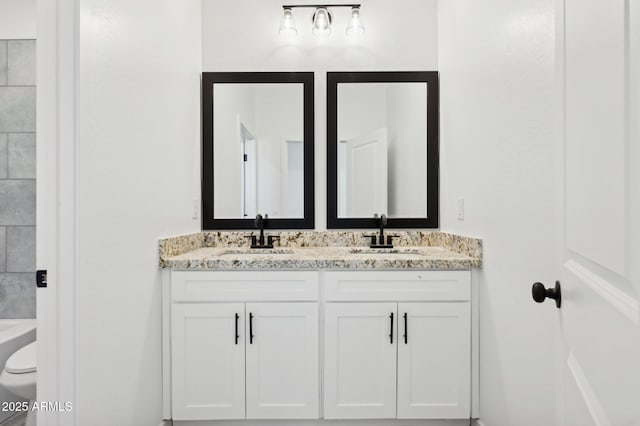 bathroom with toilet and vanity