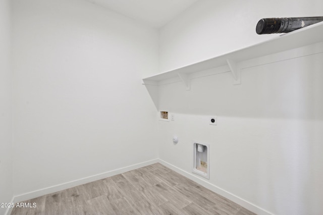 laundry area featuring hookup for a gas dryer, washer hookup, hookup for an electric dryer, and light hardwood / wood-style floors