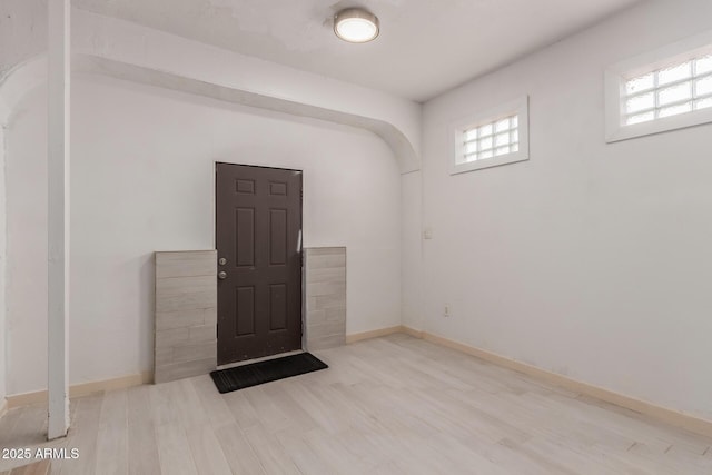 foyer entrance with light hardwood / wood-style flooring