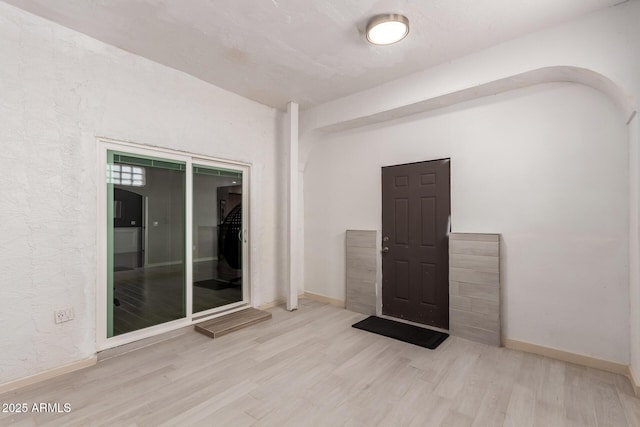 spare room featuring light wood-type flooring