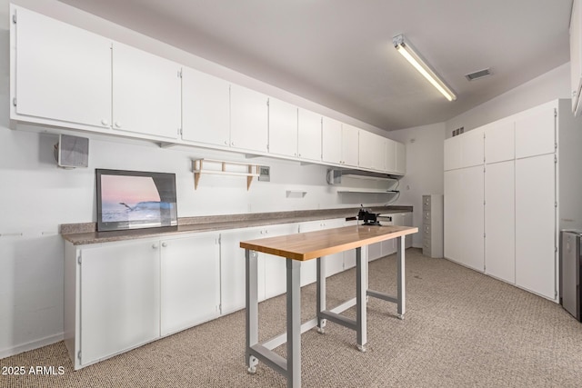 kitchen featuring white cabinets