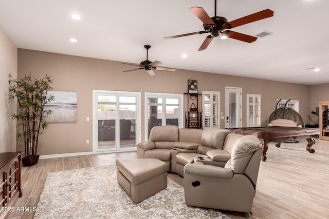 living room with light hardwood / wood-style flooring