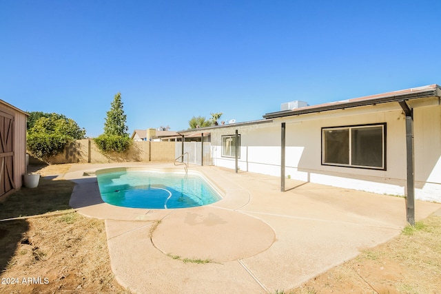 view of swimming pool with a patio