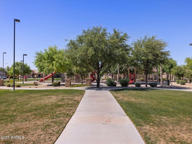 view of community with a yard and a playground