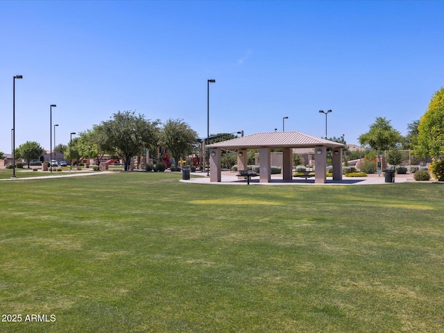 surrounding community with a gazebo and a lawn