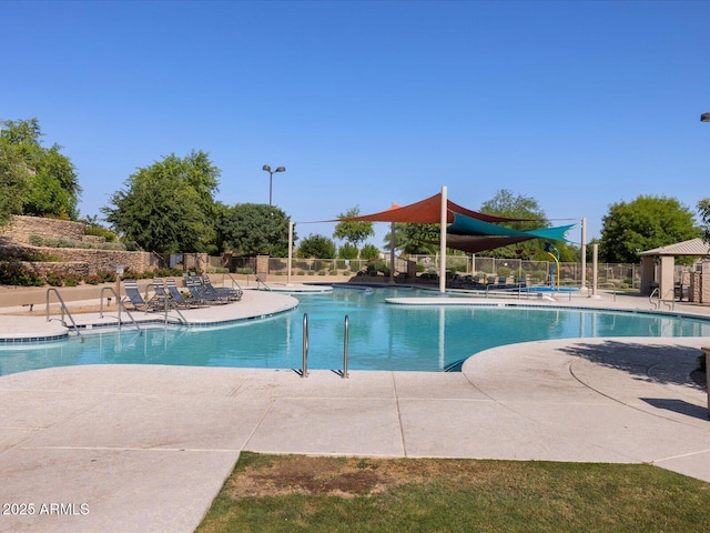 view of swimming pool with a patio