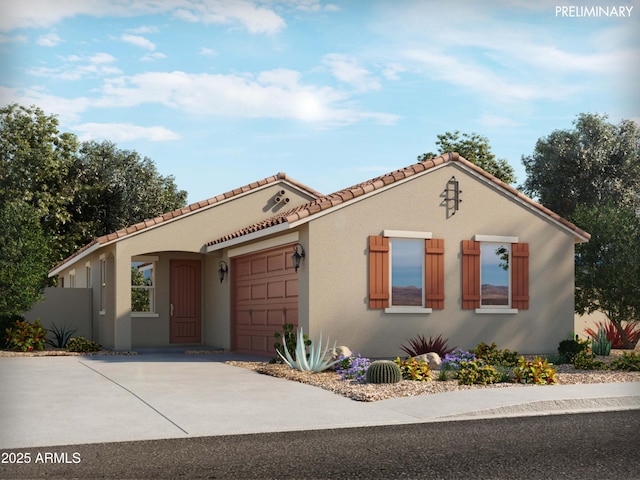 mediterranean / spanish-style house with a garage