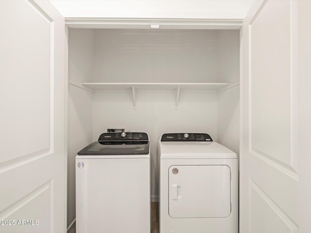 laundry room featuring separate washer and dryer