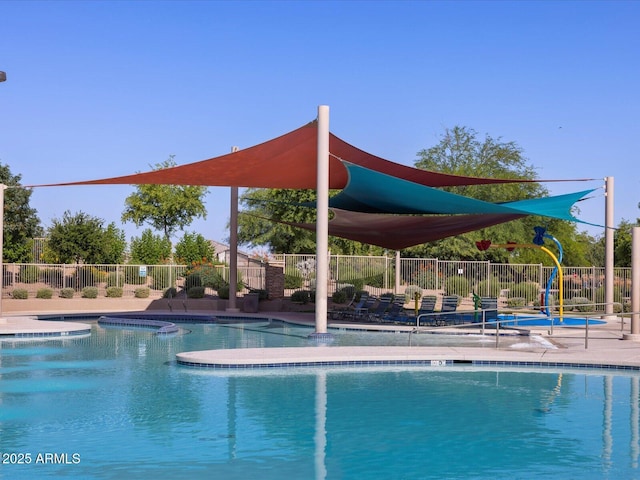 view of swimming pool featuring a jacuzzi