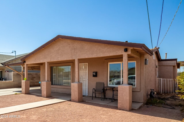 rear view of property with a patio area