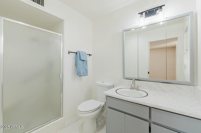 bathroom featuring walk in shower, vanity, and toilet