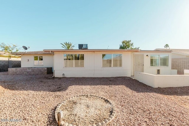 rear view of property with central air condition unit