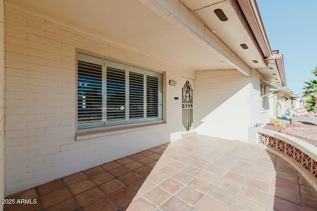 property entrance with a patio area