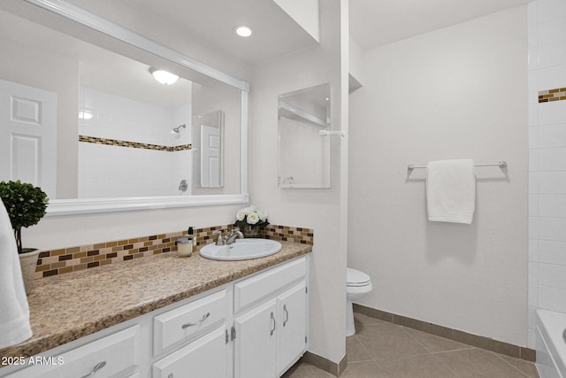 bathroom with decorative backsplash, toilet, vanity, and tile patterned flooring